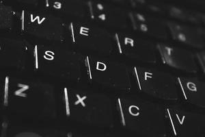 Black laptop detail of keyboard close up photo