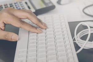 Business concept of financial and accounting with typing keyboard. photo