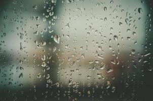 Background and wallpaper by rainy drop and water drops on window. photo