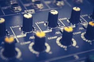 Audio mixer console and sound mixing with buttons and sliders. photo