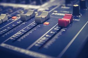Audio mixer console and sound mixing with buttons and sliders. photo