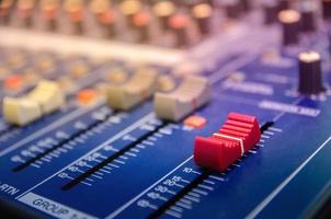 Audio mixer console and sound mixing with buttons and sliders. photo