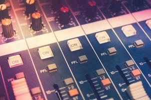 Audio mixer console and sound mixing with buttons and sliders. photo