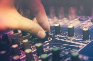 Audio mixer console and sound mixing with buttons and sliders. photo
