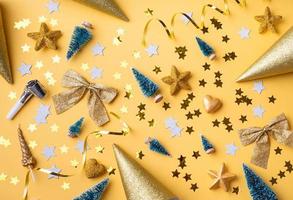 Golden Christmas and New Year decorations with confetti photo