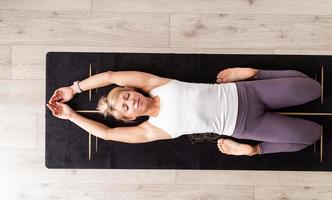 Young attractive woman practicing yoga, wearing sportswear photo