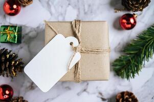 Gift boxes with small gifts on white cement photo