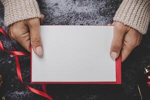 Hands holding opened card or letter photo