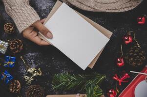 Hands holding opened card or letter photo