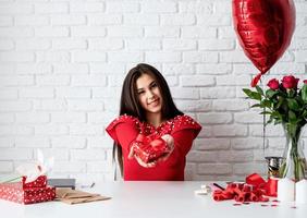 Woman holding a gift for Valentine's Day photo