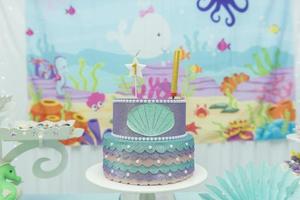 Cake table overview decorated with the seabed theme. photo