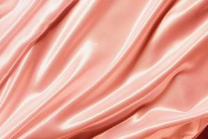 Abstract rose gold satin silky cloth for background photo