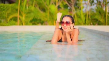 Young Asian Woman Enjoys Outdoor Swimming Pool video