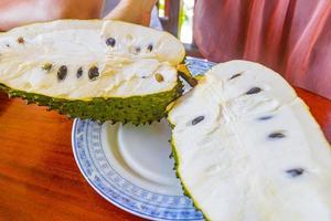 Sliced soursop Sauersack tropical fruit on white plate Sri Lanka. photo