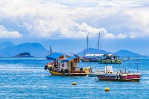 Boats ships and Boat trips Abraao beach Ilha Grande Brazil. photo