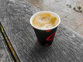 Red paper cup with coffee to go. Leherheide, Bremerhaven. photo