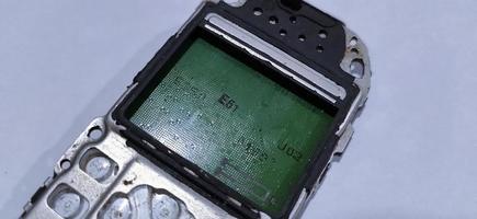 The damaged circuit board cellular is an older model photo