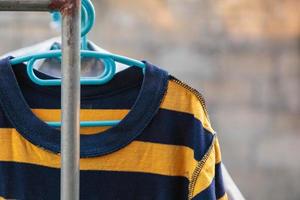 Dry clothes in bright colors in the sun. photo