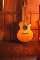 Classical guitar on wooden background