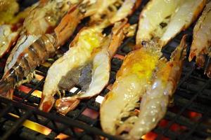 Shrimp grill on fire in Thailand photo