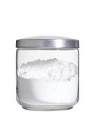 White flour in bottle on white background photo