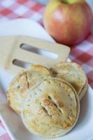 Three Apple Hand Pies With Spatula photo