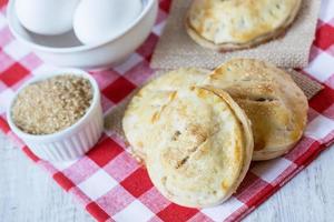 Autumn Apple Hand Pies with Raw Sugar and Eggs Close photo