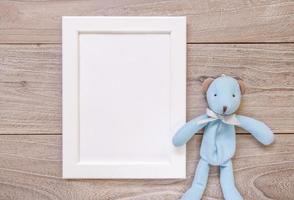 Retro wood vintage table white frame mock up cute blue bear doll photo