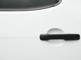 Black car door handle on white background photo