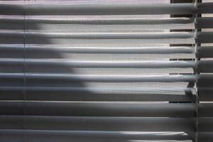 Light and shade shining on the window blinds photo