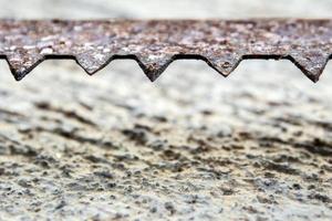 The sharpness of saw blade is old and rusty photo