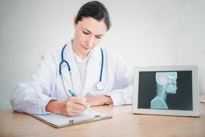 Medical Doctor is Working in Hospital Examination Room photo