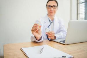 Medical Doctor is Examining Patient Health With Thermometer Fever photo