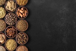 Spices  over black table background photo