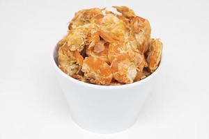 Dried shrimp in a white cup on a white background photo