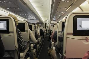 Sitting on the plane. View into the aisle. photo