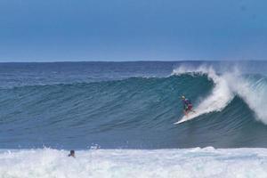 Surfers at the North Shore of Hawaii photo