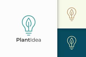 Light bulb and leaf logo represent energy and innovation vector