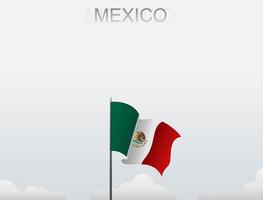 bandera de mexico volando bajo el cielo blanco vector