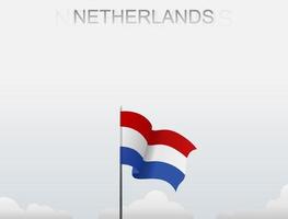 Flag of Netherlands flying under the white sky vector