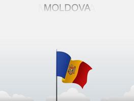 Flag of Moldova flying under the white sky vector