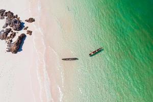 Aerial view of tourists paddle kayak in boulder island photo