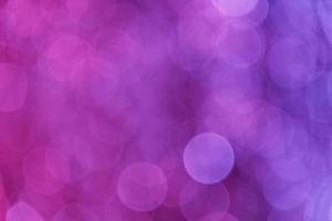 Pink with a violet dark background with abstract blurred highlights photo