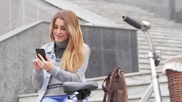 Young woman with retro bicycle outdoors video