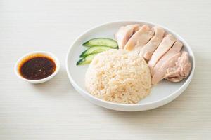 Hainanese chicken rice or rice steamed with chicken soup photo