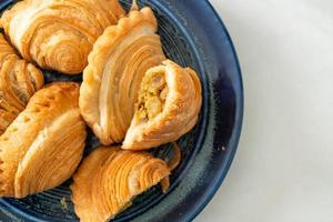 Curry puff stuffed chicken on plate photo