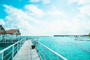 Beautiful tropical Maldives resort hotel and island with beach and sea photo