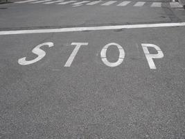 Stop sign on tarmac photo