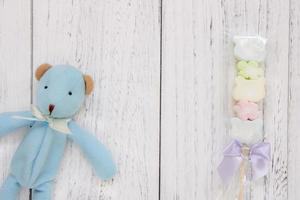 White painted wood table blue bear doll cotton candy photo