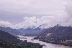 Cloudy day mountain Yangtze river in Yunnan Province, China photo